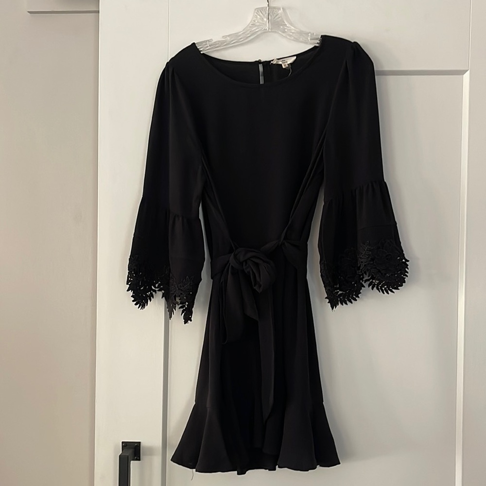 Beautiful LBD with embellished bell sleeves, comes with black belt.